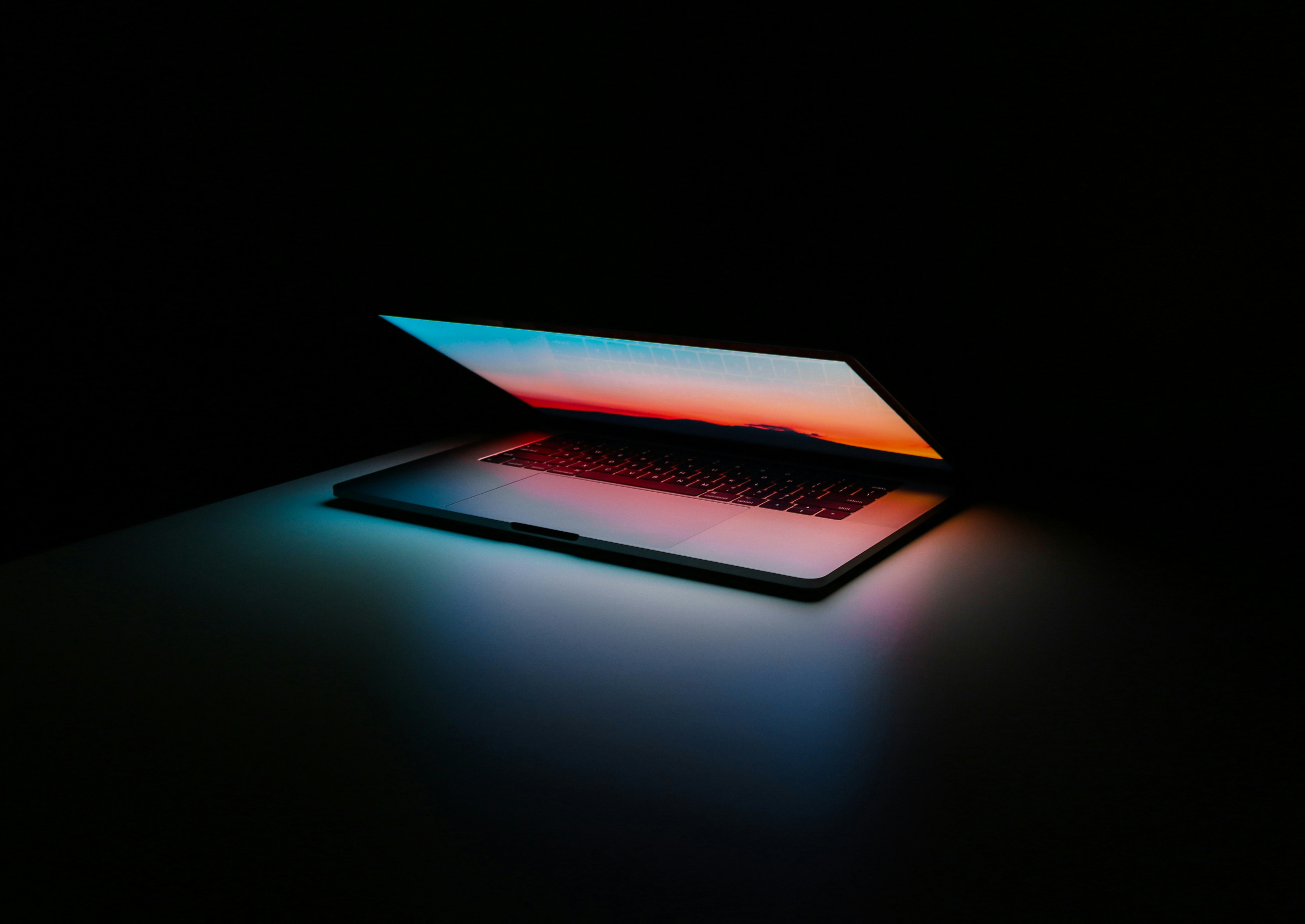 A generic workspace or office desk with a laptop — stock photo representing modern work environments