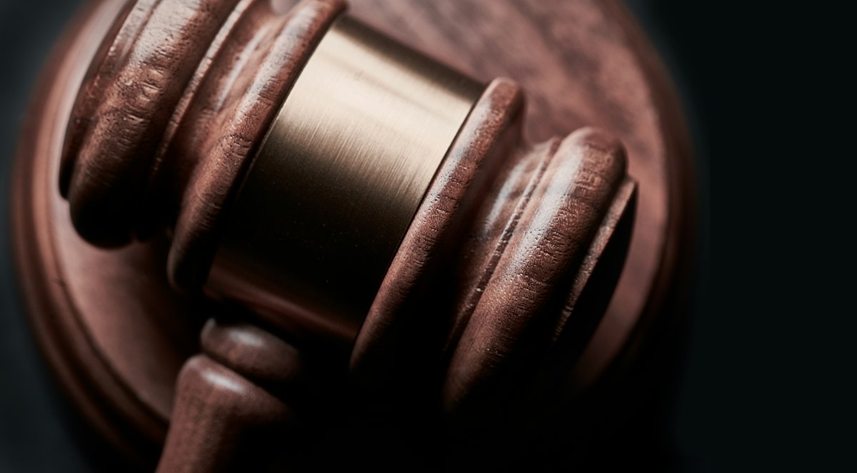 Generic Unsplash stock photo of grand neoclassical courthouse columns, used to illustrate the subject of the Buist v. Anthropic antitrust lawsuit — not a photo of the courthouse, complaint, or any person involved in this case