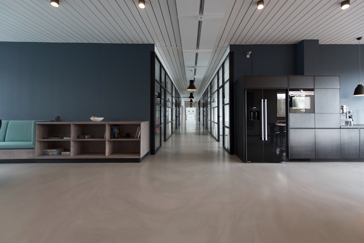 Generic Unsplash stock photo of a modern open-plan tech office with employees at their desks, symbolizing the AI industry affected by this case — not a photo of any of the defendant companies' actual offices