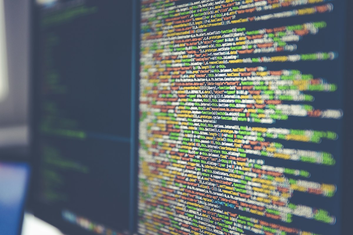 Illustrative stock photo of program code on a dark computer screen — decorative header image for this September 2026 model comparison, not an actual screenshot of benchmark data