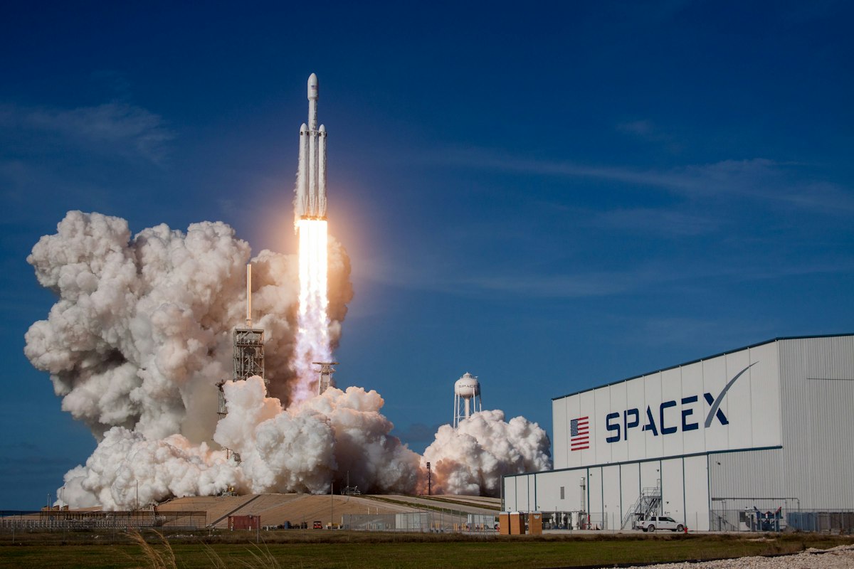 A rocket lifting off at night against a dark sky — a generic stock photo used to represent the countdown to Moonshot's November 4 open-weights release