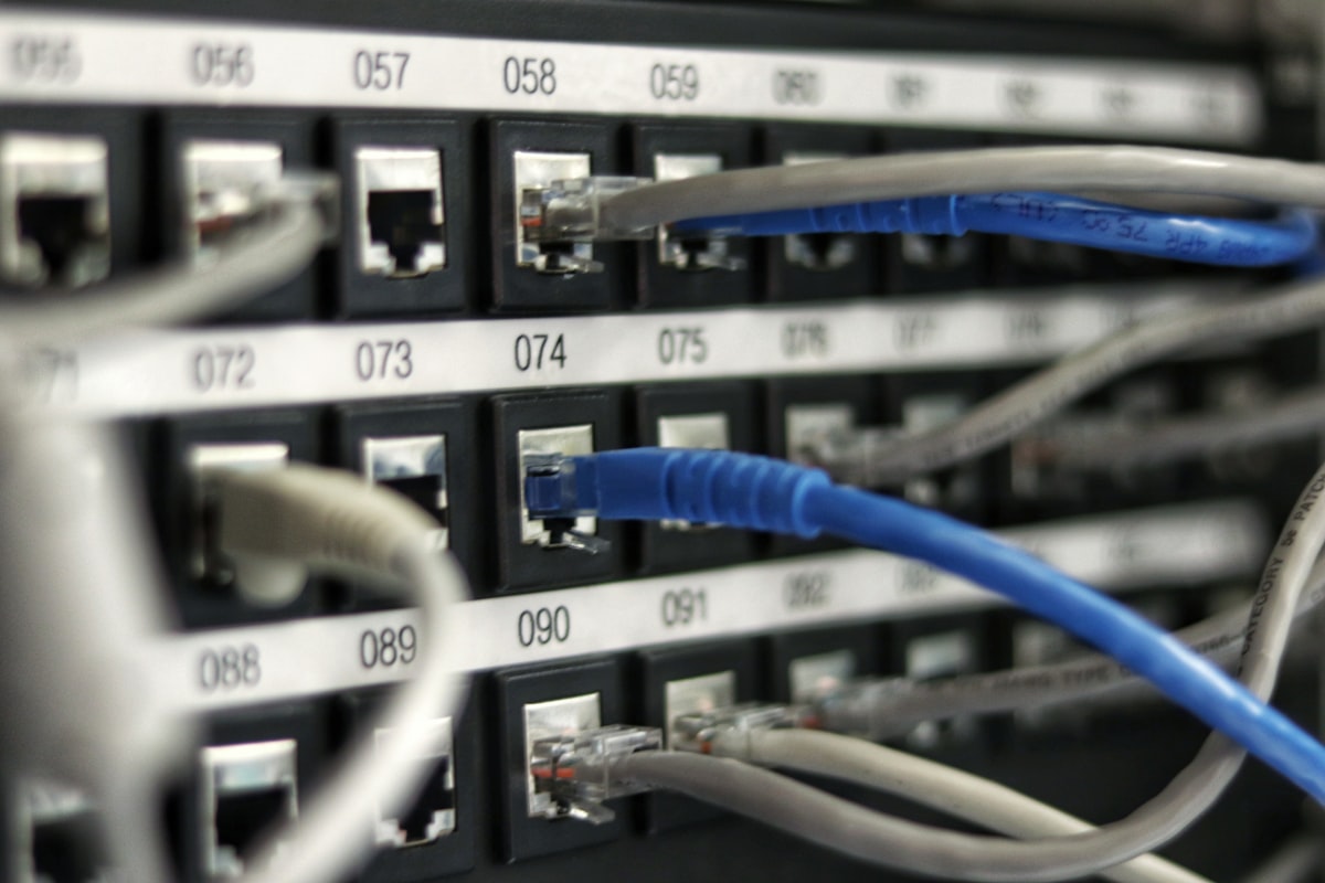 A data center network patch panel — a generic infrastructure stock photo, not an actual GPU cluster