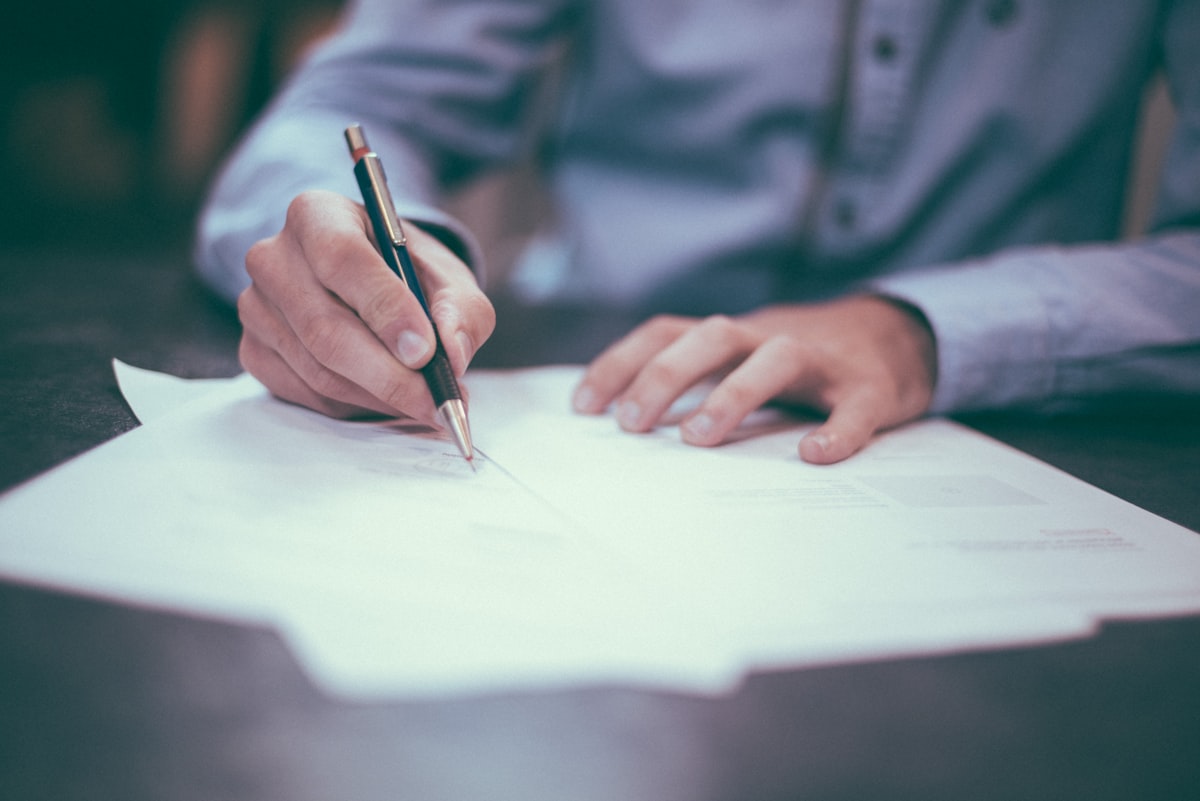 Close-up of documents, audit checklists, and printed reports on a desk — a generic stock photo symbolizing written records and documentation, not an actual diagram from OpenAI's incident reports