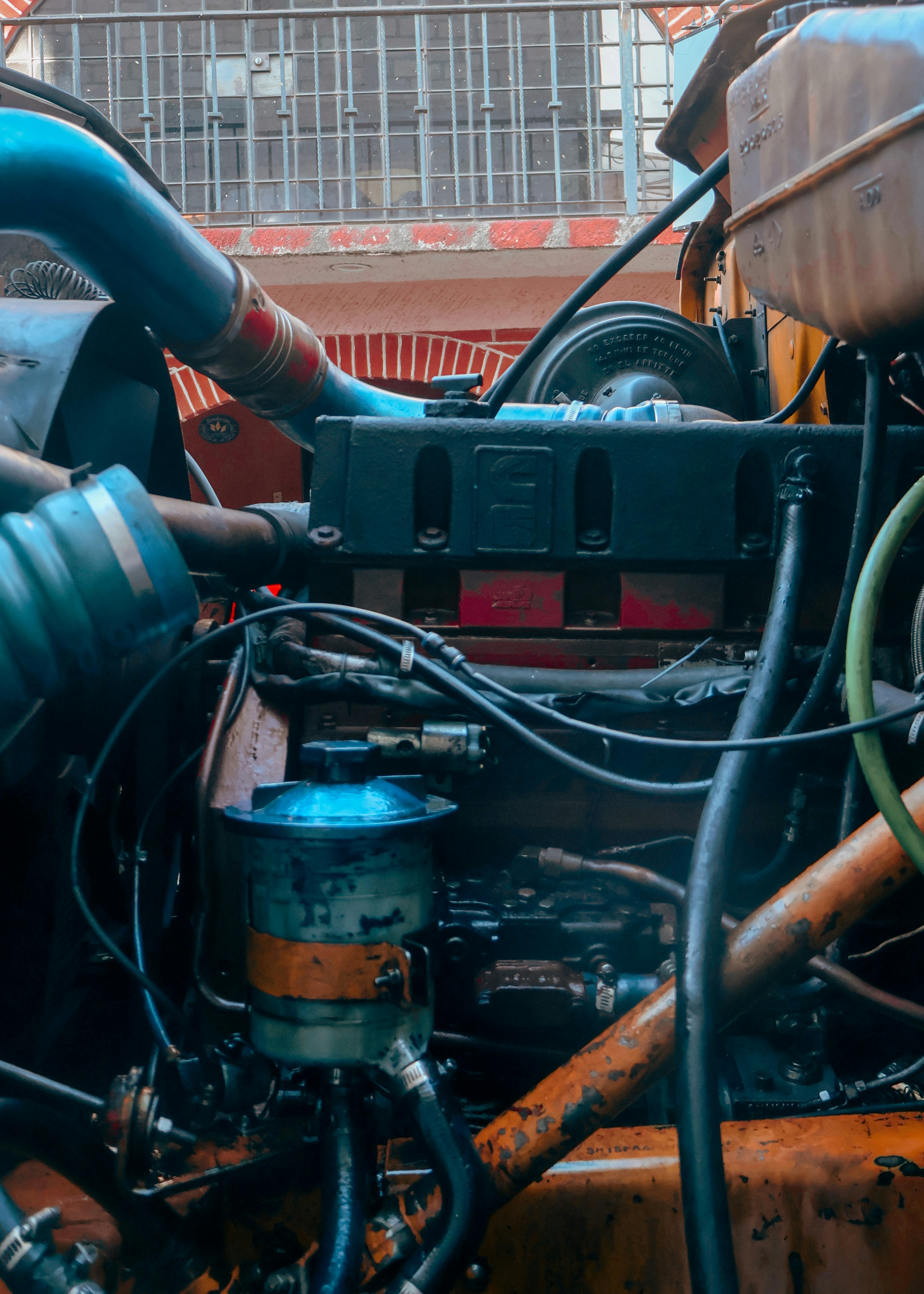 Simplified diesel engine and hydraulic assembly without cloud-connected electronics, demonstrating mechanical-first tractor design