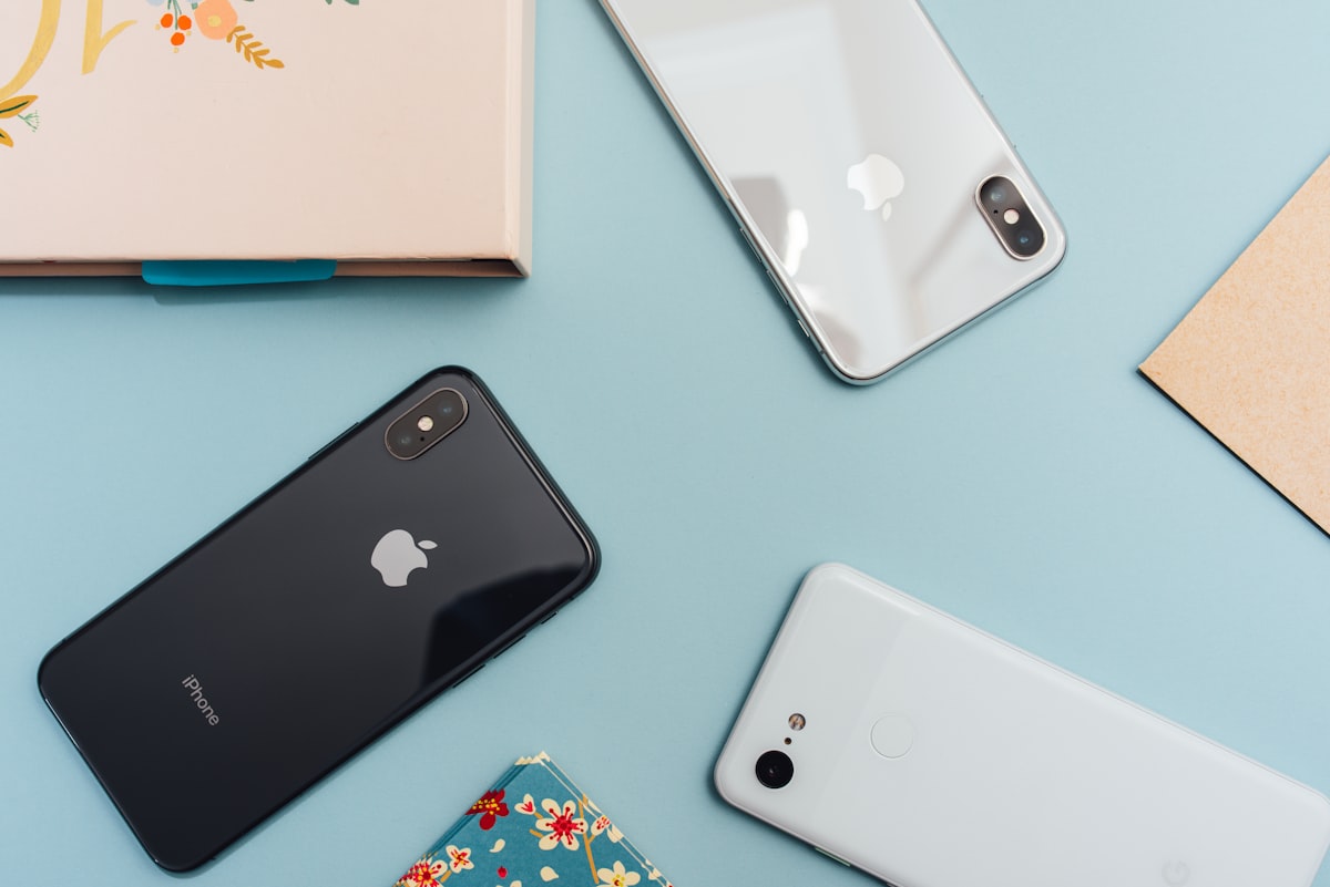 Generic stock photo of a smartphone with a bright display — used to illustrate AI-powered photo editing on a phone, not a screenshot of Apple Photos, Spatial Reframing, Extend, or Clean Up