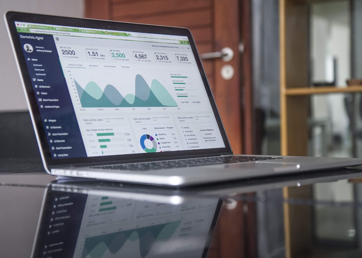 A generic analytics dashboard on a laptop — a stock photo, not an actual CI/CD savings infographic
